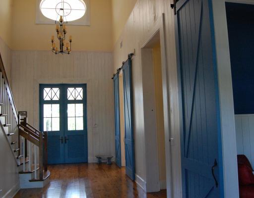 5575 Pennock Point Road Jupiter, FL 33458 - Photo 12 of 16 a view of a hallway with wooden floor and staircase
