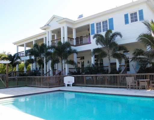 5575 Pennock Point Road Jupiter, FL 33458 - Photo 2 of 16 a house view with a garden space