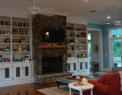 5575 Pennock Point Road Jupiter, FL 33458 - Photo 7 of 16 a living room with furniture a lamp and a fireplace