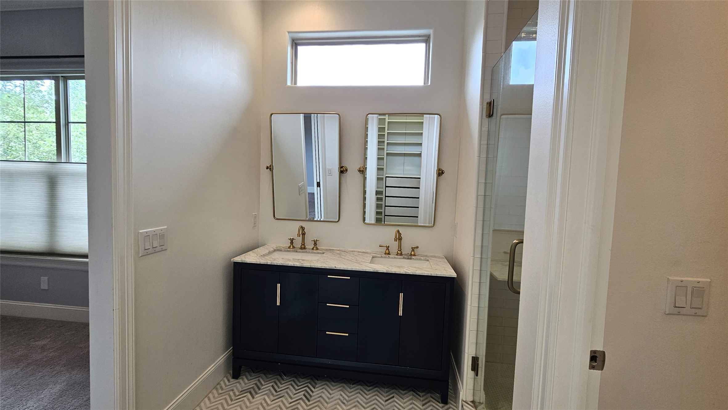 902 West 23rd Street, Unit I Houston, TX 77008 - Photo 10 of 36 a bathroom with a double vanity and a mirror