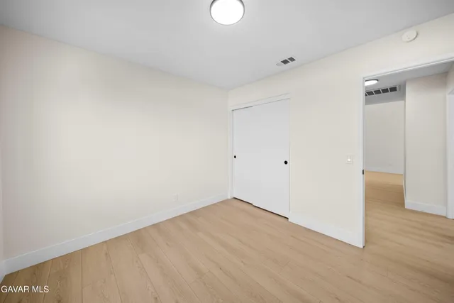a bathroom with a double vanity sink mirror and toilet