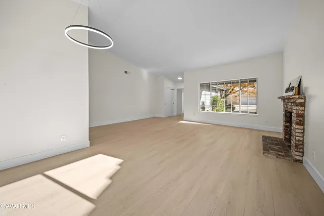 a kitchen with a stove top oven sink and window