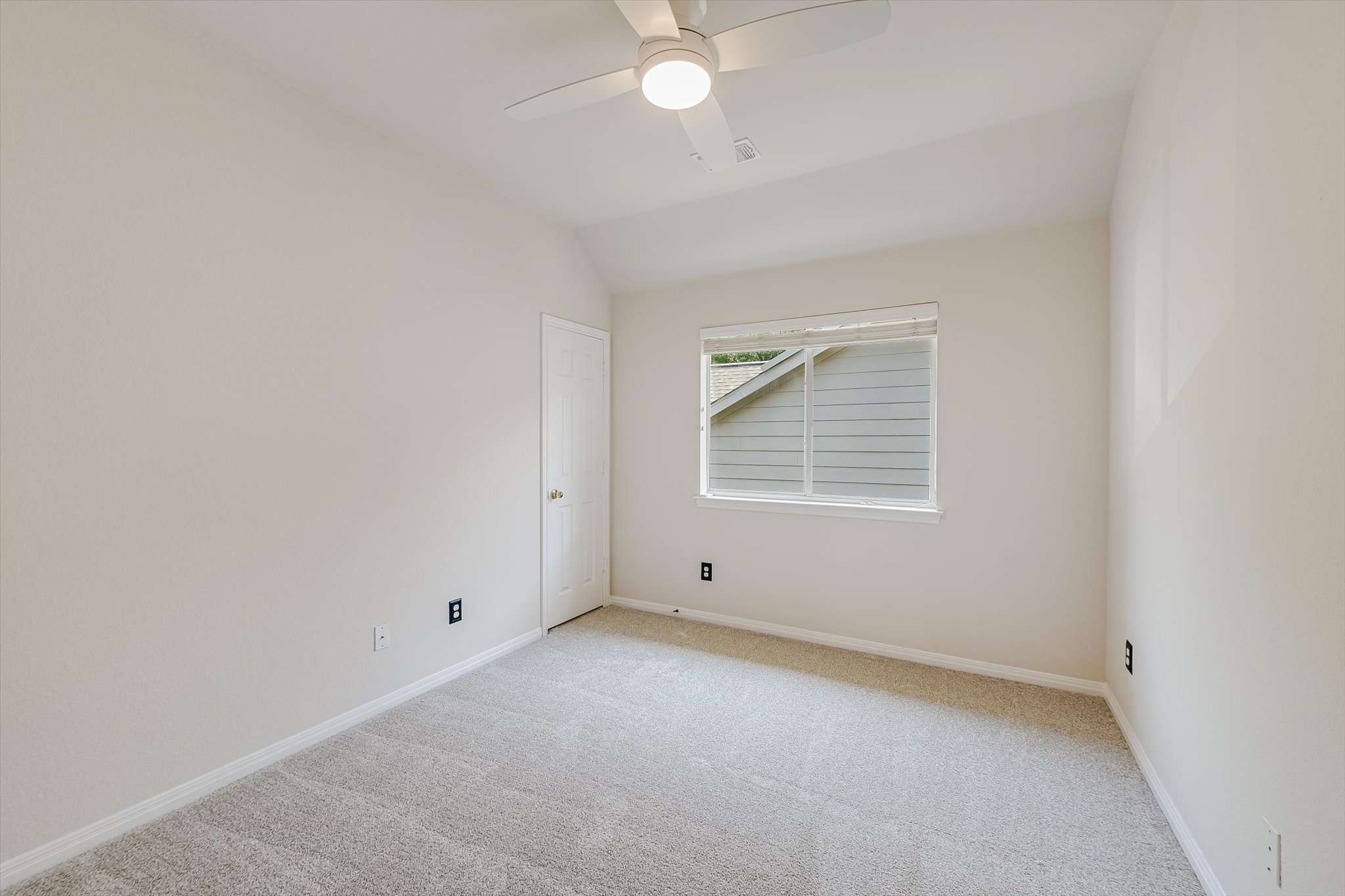 2849 Grimes Ranch Road Austin, TX 78732 - Photo 24 of 31 A quiet bedroom with a ceiling fan and plush carpet provides a comfortable retreat.