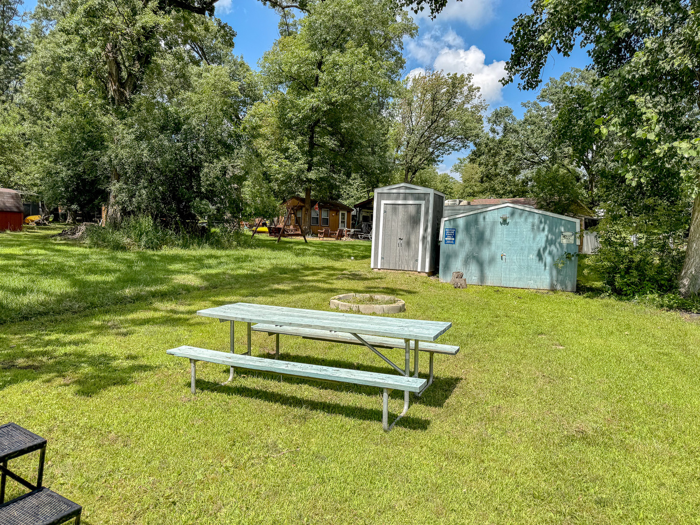 8-110 Woodhaven Sublette, IL 61367 - Photo 5 of 13 a garden view with a bench