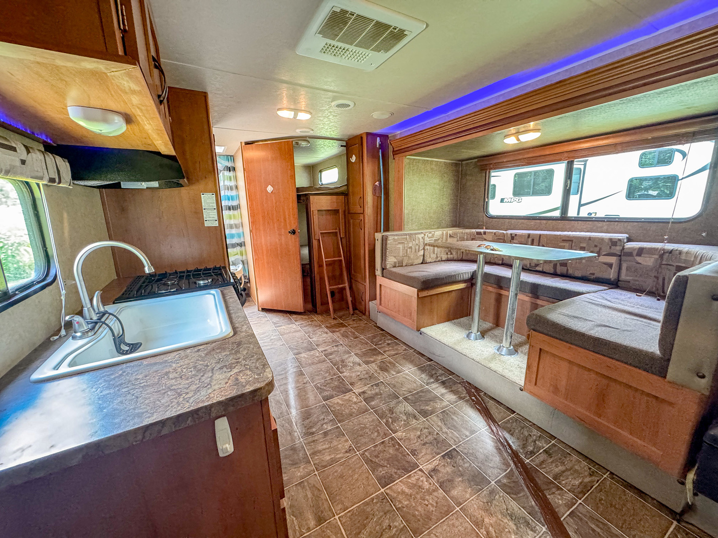 8-110 Woodhaven Sublette, IL 61367 - Photo 7 of 13 a kitchen with stainless steel appliances granite countertop a sink and a refrigerator