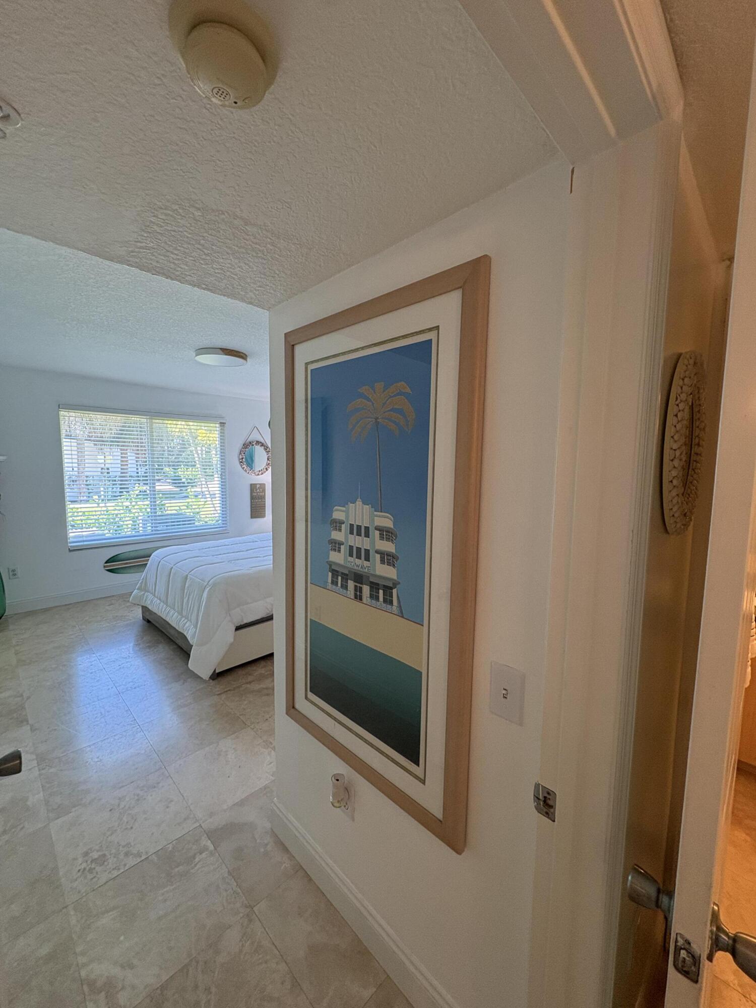 1205 Villa Lane, Unit 1205 Boynton Beach, FL 33435 - Photo 12 of 19 a living room with furniture and a gate