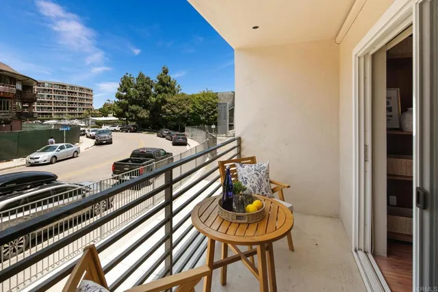 a view of a balcony dining table and chairs