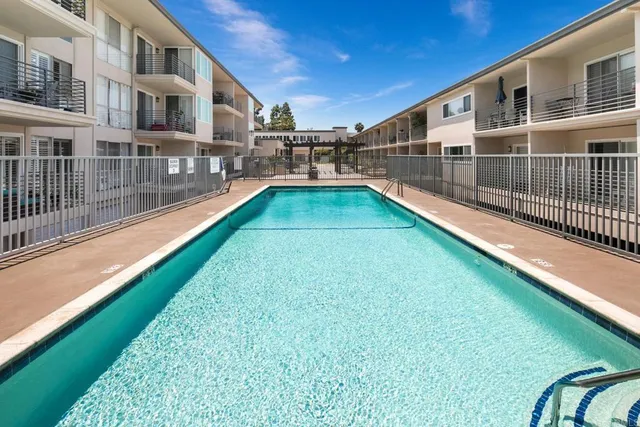 a view of a swimming pool with a yard