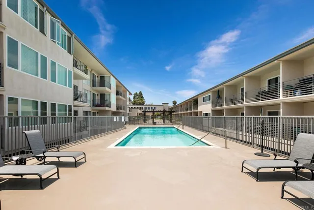 a view of a swimming pool with a lounge chair