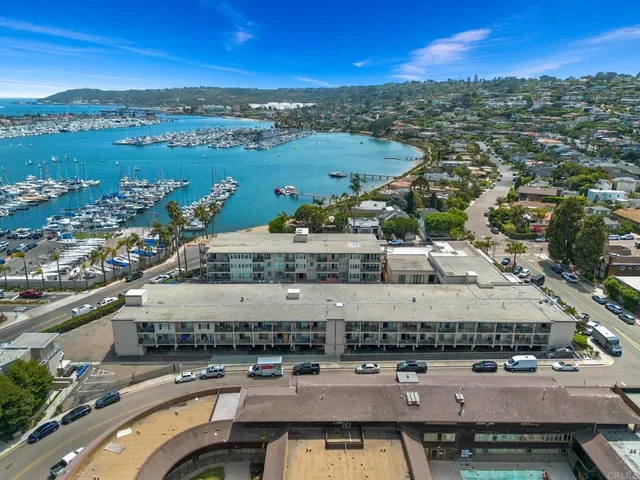 an aerial view of a house with a lake view