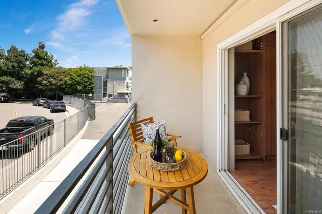 a view of a balcony and chairs