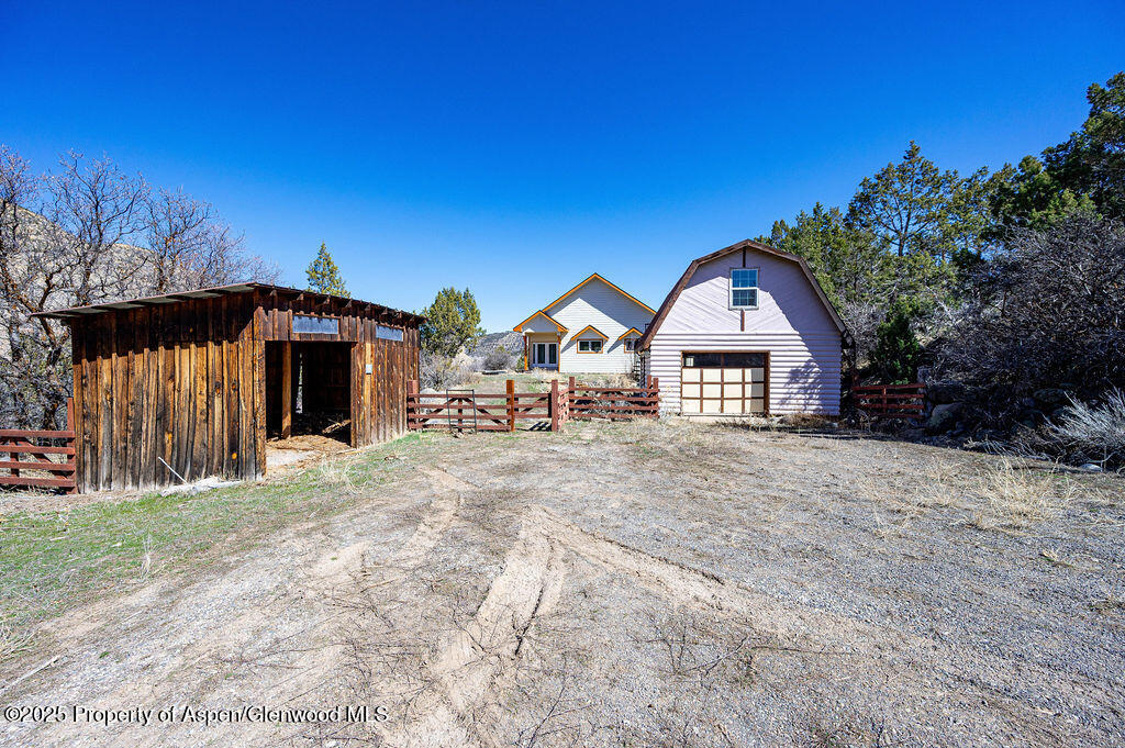 53404 Highway 330 Collbran, CO 81624 - Photo 1 of 43 a view of a house with a yard and large trees