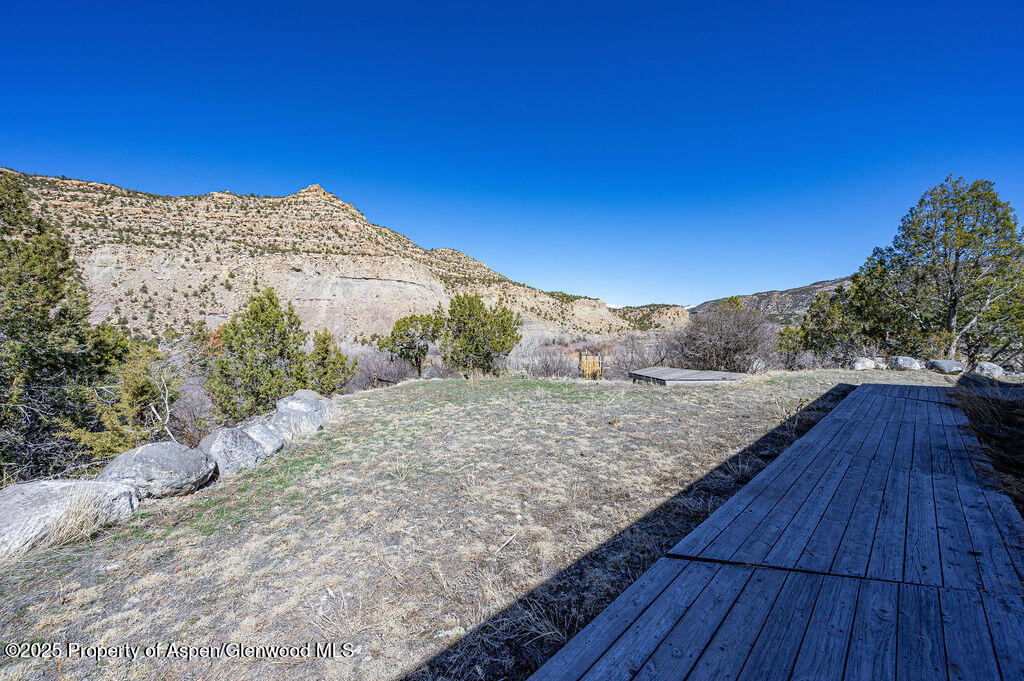 53404 Highway 330 Collbran, CO 81624 - Photo 12 of 43 a view of a dry yard with wooden fence