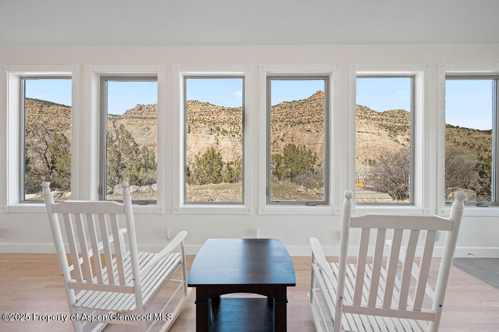 53404 Highway 330 Collbran, CO 81624 - Photo 15 of 43 a view of a dining room with furniture and windows