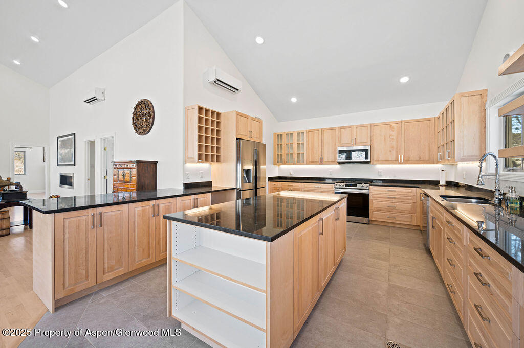 53404 Highway 330 Collbran, CO 81624 - Photo 20 of 43 a kitchen with stainless steel appliances granite countertop a sink and a stove