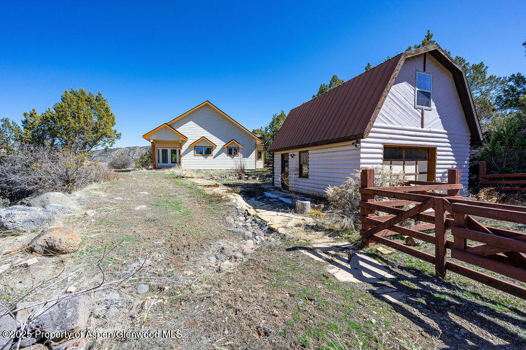 53404 Highway 330 Collbran, CO 81624 - Photo 2 of 43 a front view of a house with large trees