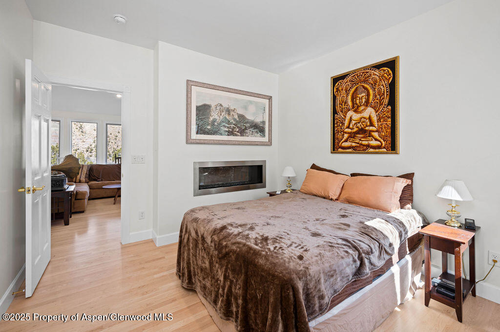53404 Highway 330 Collbran, CO 81624 - Photo 25 of 43 a spacious bedroom with a bed and a couch
