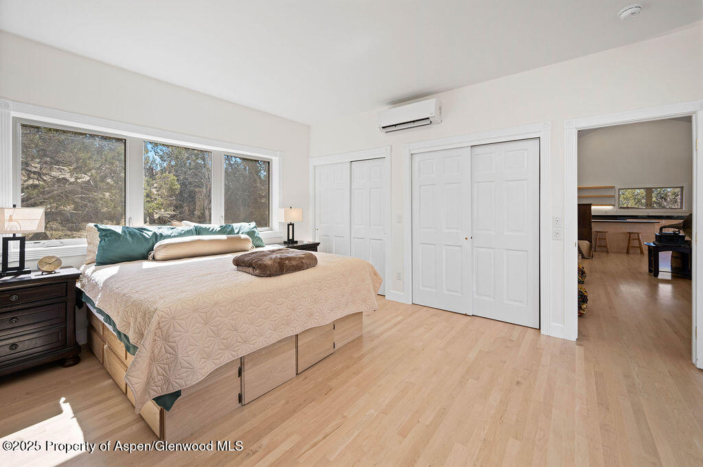 53404 Highway 330 Collbran, CO 81624 - Photo 28 of 43 a spacious bedroom with a bed and a large window