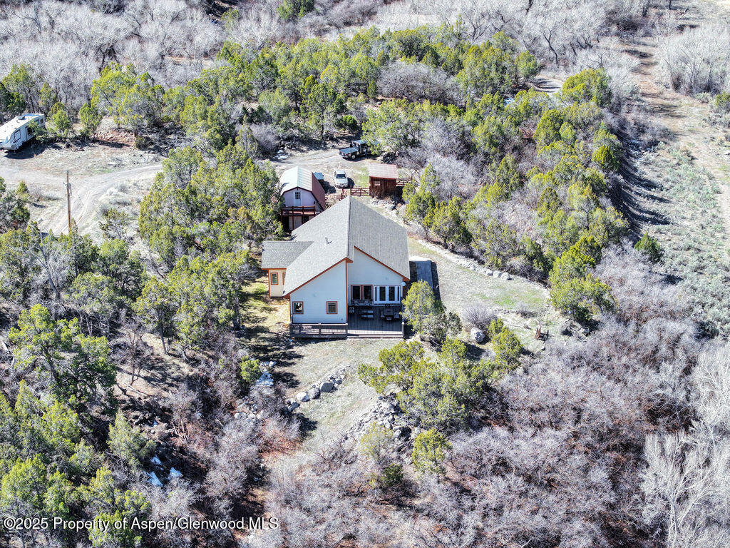 53404 Highway 330 Collbran, CO 81624 - Photo 36 of 43 an aerial view of a house with a yard