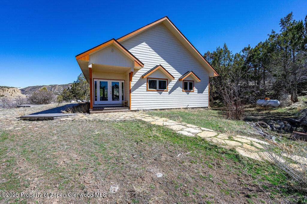 53404 Highway 330 Collbran, CO 81624 - Photo 5 of 43 a front view of a house with a yard
