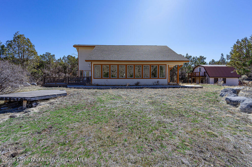 53404 Highway 330 Collbran, CO 81624 - Photo 6 of 43 a view of a house with a yard and sitting area