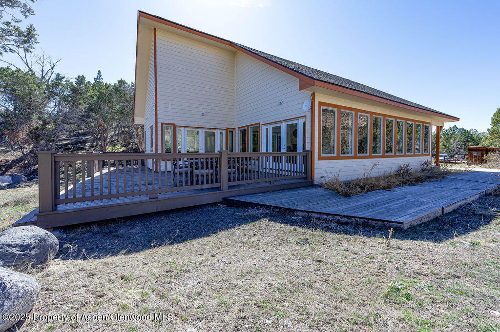 53404 Highway 330 Collbran, CO 81624 - Photo 7 of 43 a view of a house with a yard