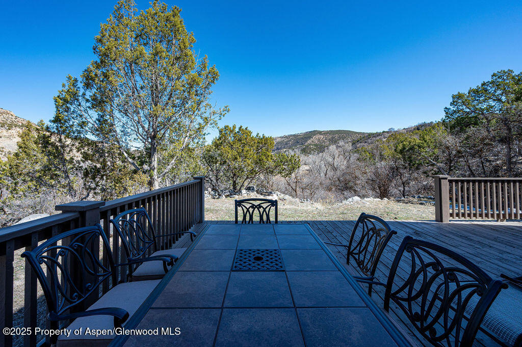 53404 Highway 330 Collbran, CO 81624 - Photo 9 of 43 a view of balcony with wooden floor and outdoor seating