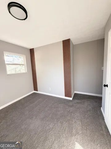 a dining room with table chairs and wooden floor