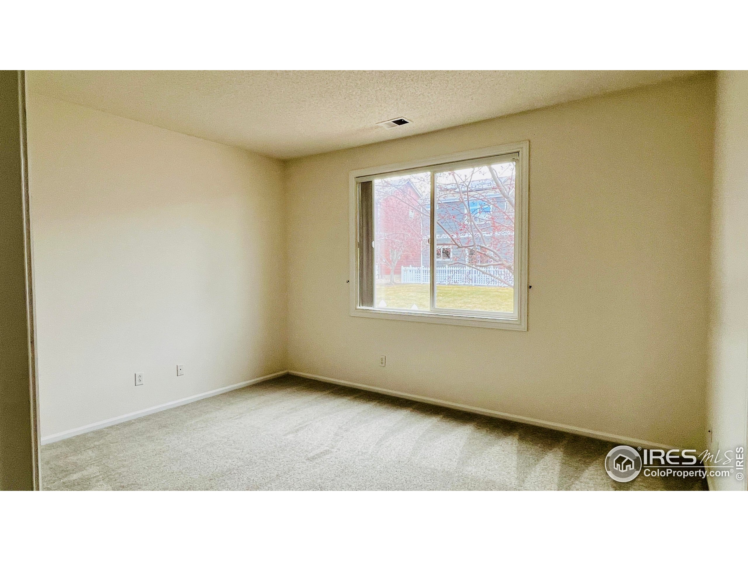 13963 Cook Street Thornton, CO 80602 - Photo 11 of 18 a open living room with a window