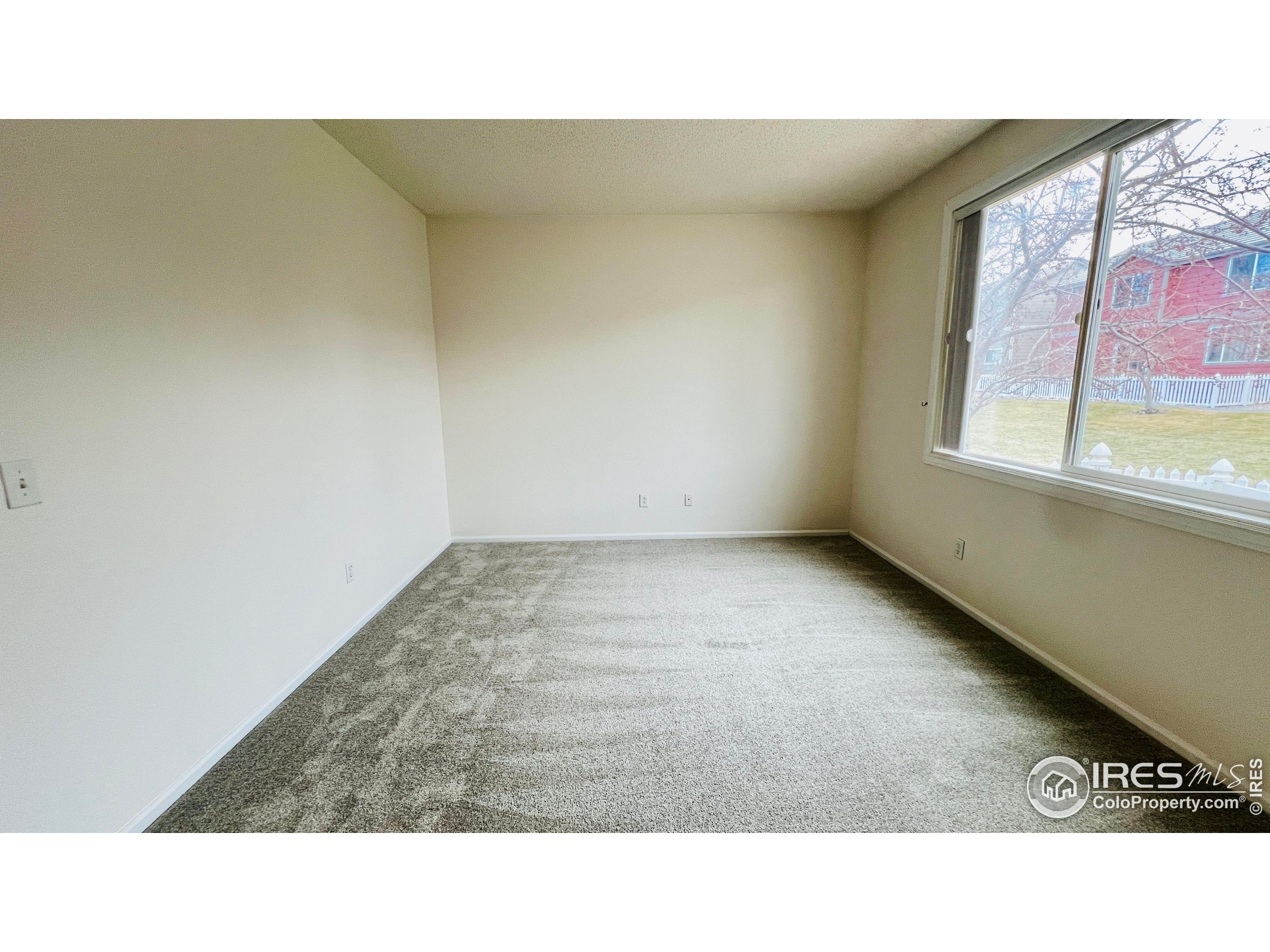 13963 Cook Street Thornton, CO 80602 - Photo 12 of 18 a open space with a window