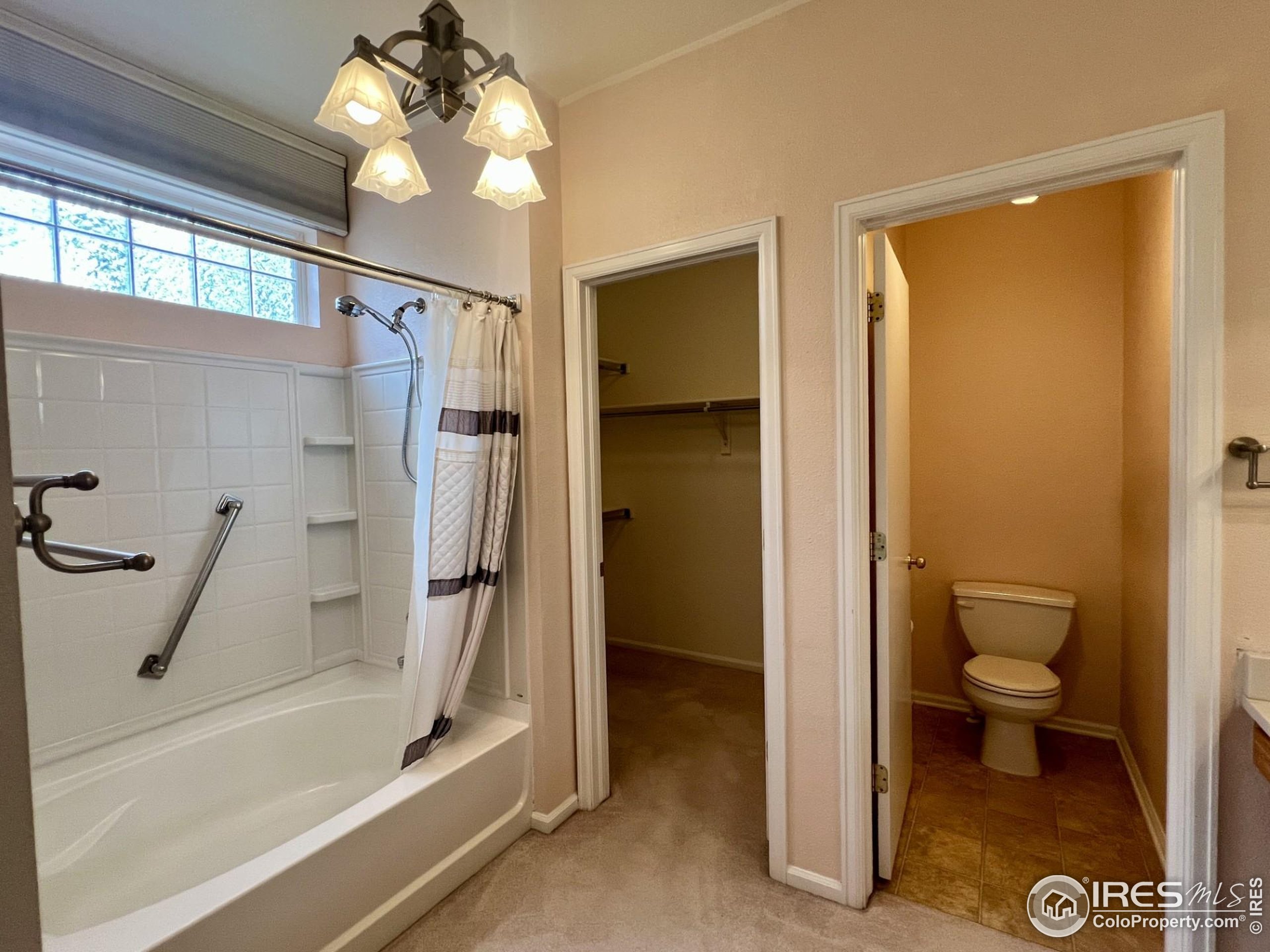 13963 Cook Street Thornton, CO 80602 - Photo 14 of 18 a bathroom with a granite countertop shower a toilet and a sink