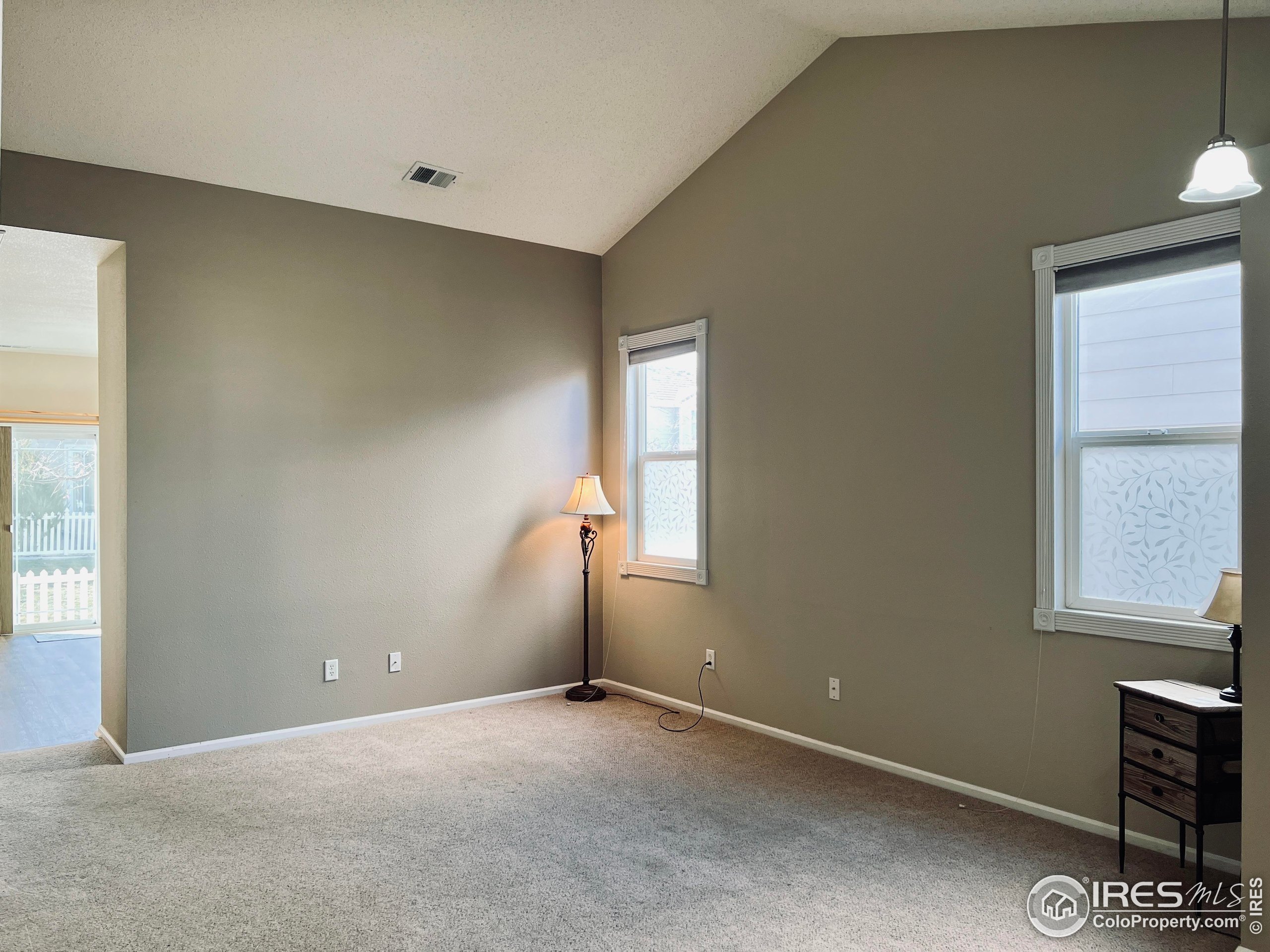 13963 Cook Street Thornton, CO 80602 - Photo 3 of 18 an empty room with windows and closet