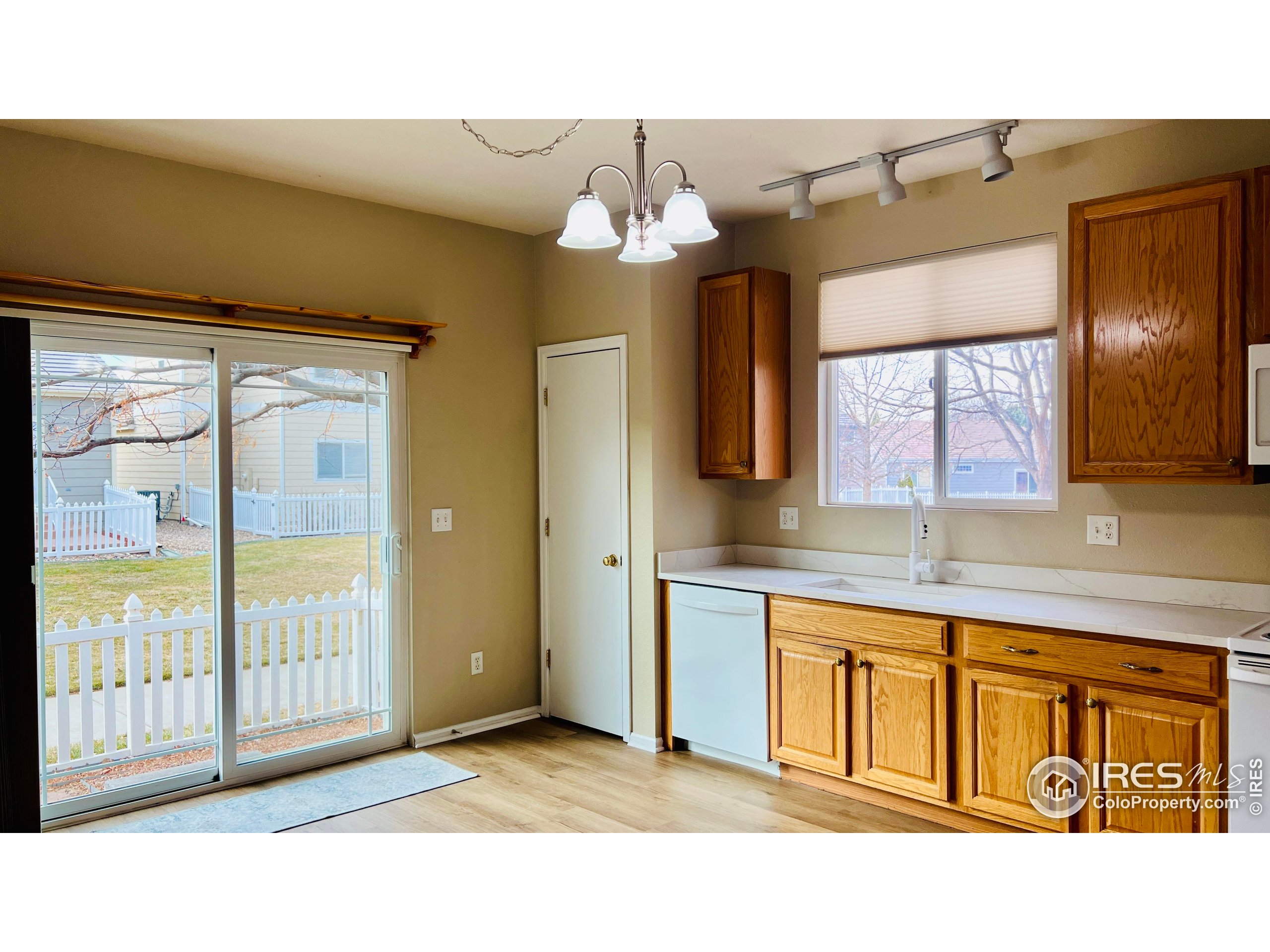 13963 Cook Street Thornton, CO 80602 - Photo 6 of 18 a bathroom with a balcony a sink and a mirror