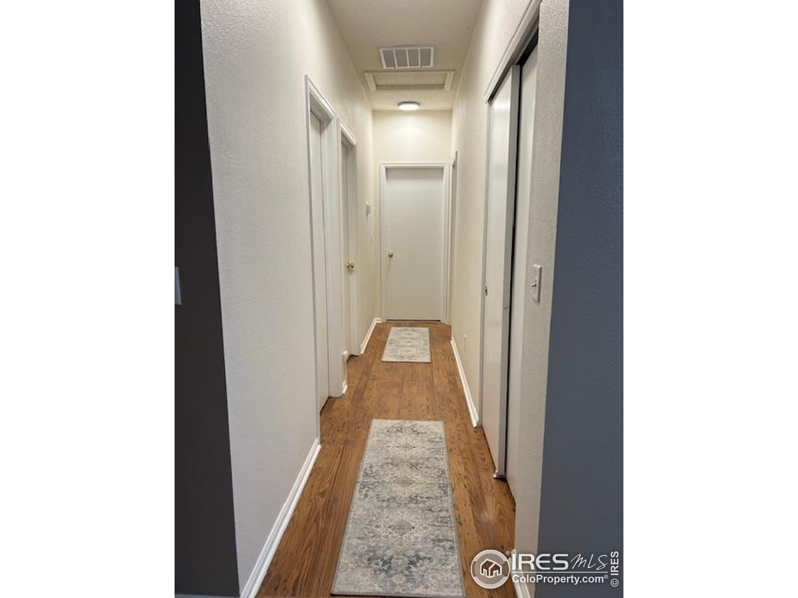 13963 Cook Street Thornton, CO 80602 - Photo 10 of 18 a view of a hallway with a room