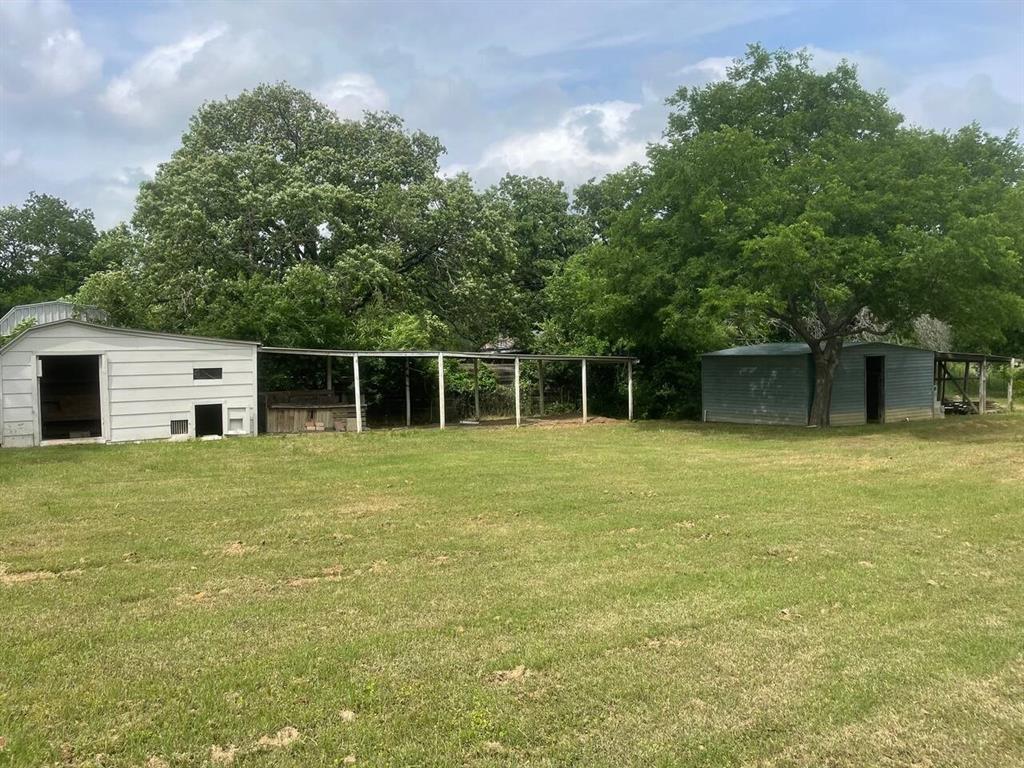 4918 Farris Road Denton, TX 76208 - Photo 27 of 28 a front view of a house with a garden