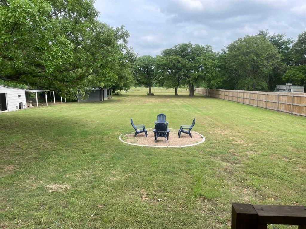 4918 Farris Road Denton, TX 76208 - Photo 28 of 28 a view of a swimming pool with a yard