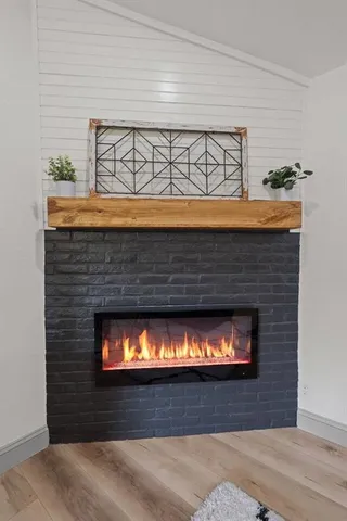 a fireplace with a clock on top of it