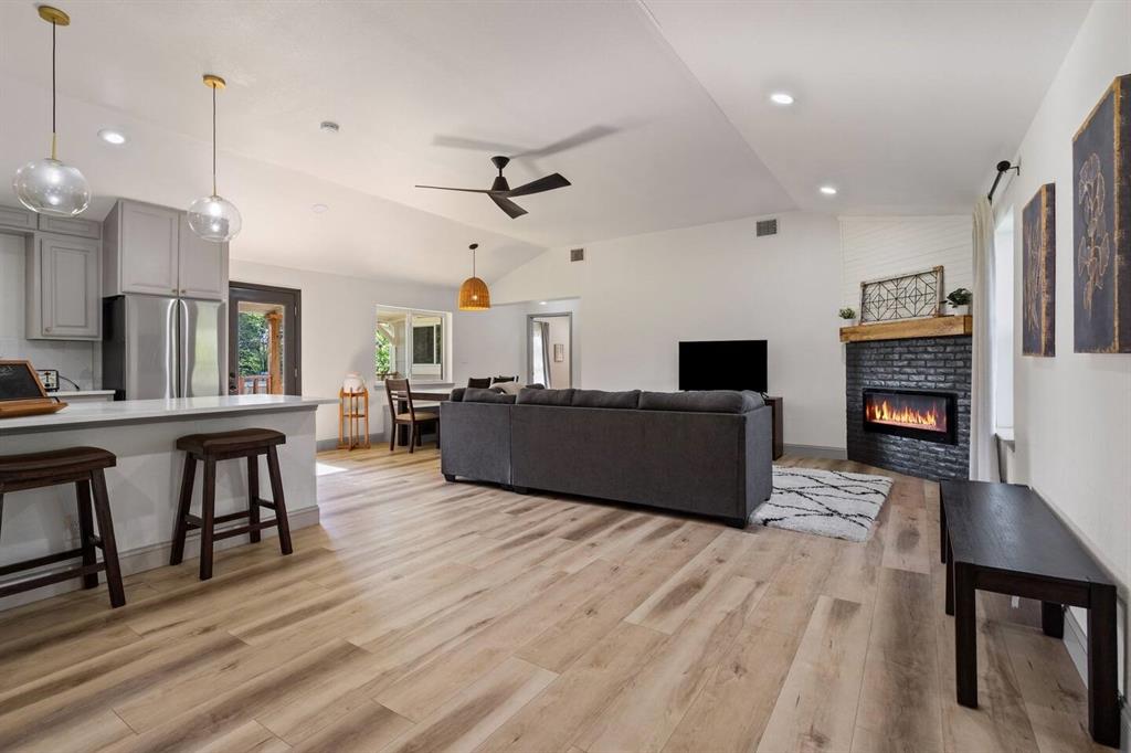 4918 Farris Road Denton, TX 76208 - Photo 6 of 28 a living room with furniture and a fireplace
