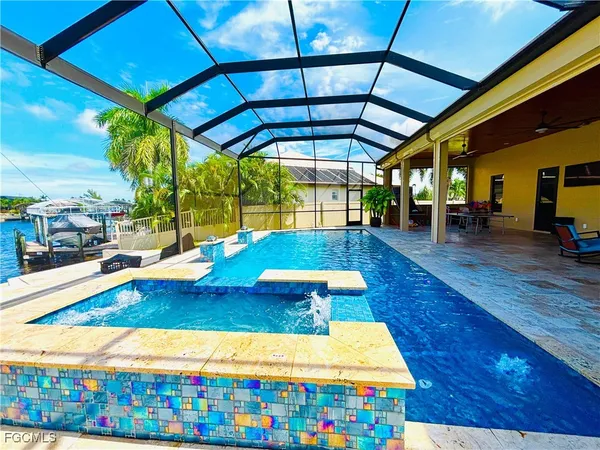 a view of swimming pool with outdoor seating