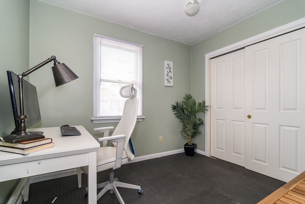 12 Vernon Road Natick, MA 01760 - Photo 11 of 25 a view of a workspace with furniture and a window