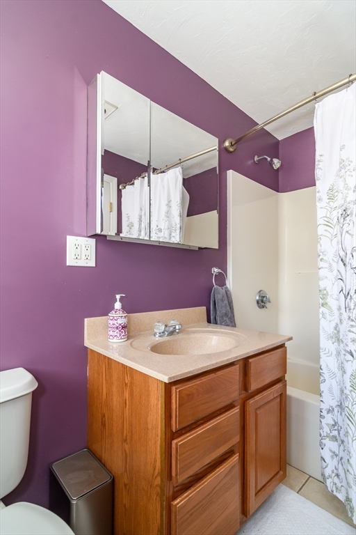 12 Vernon Road Natick, MA 01760 - Photo 12 of 25 a bathroom with a sink a toilet and mirror