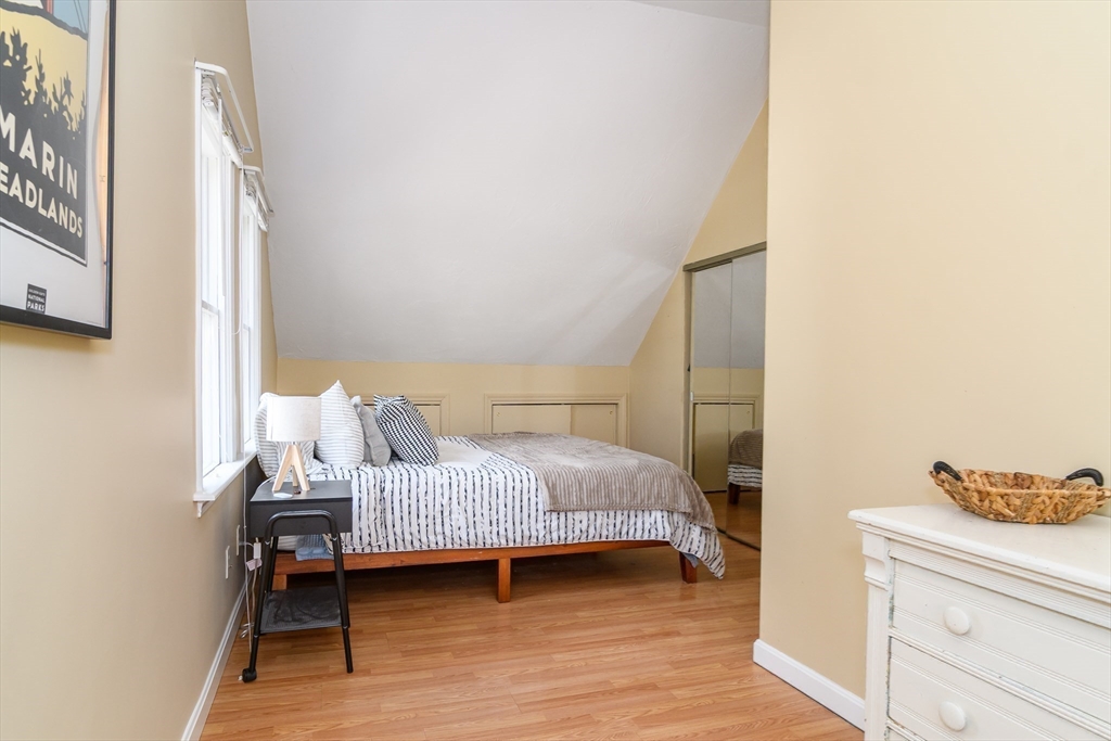 12 Vernon Road Natick, MA 01760 - Photo 13 of 25 a bedroom with a bed and wooden floor
