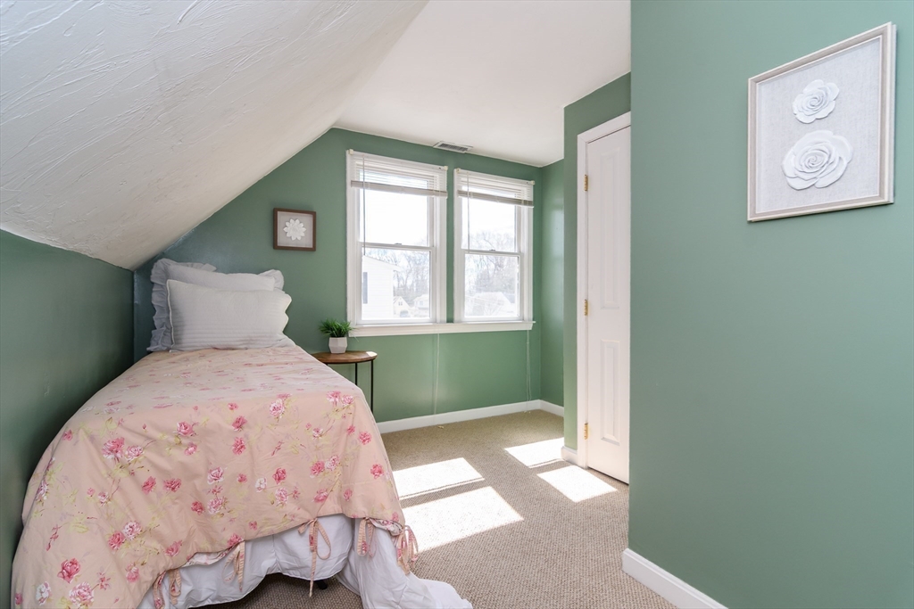 12 Vernon Road Natick, MA 01760 - Photo 16 of 25 a bedroom with a bed and window