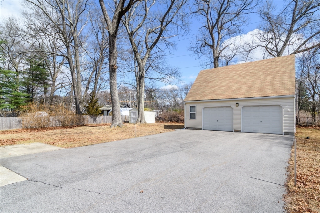 12 Vernon Road Natick, MA 01760 - Photo 21 of 25 a view of large house with a yard and garage
