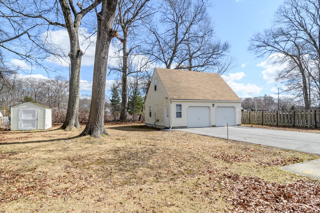 12 Vernon Road Natick, MA 01760 - Photo 22 of 25 a view of a house with a yard covered in snow