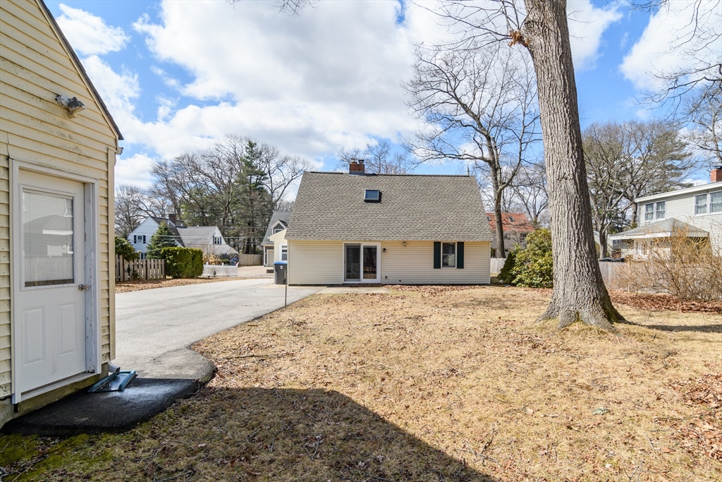 12 Vernon Road Natick, MA 01760 - Photo 23 of 25 a view of a house with a yard covered in snow
