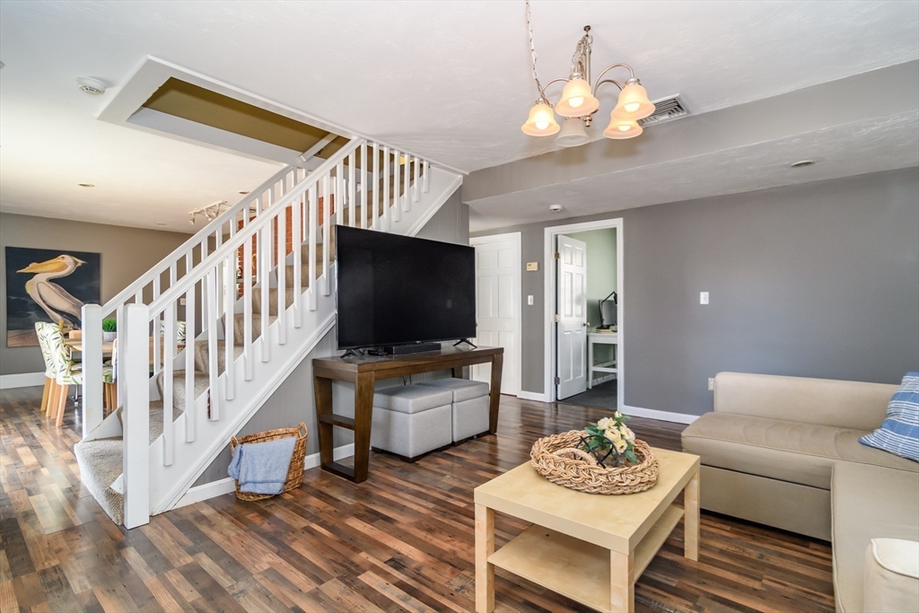 12 Vernon Road Natick, MA 01760 - Photo 10 of 25 a living room with furniture and a flat screen tv