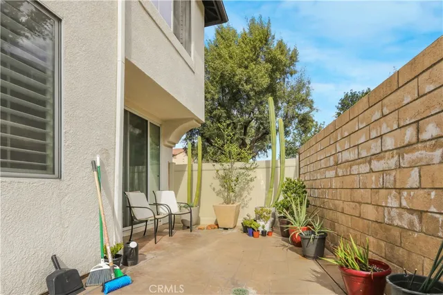 a backyard of a house with outdoor seating