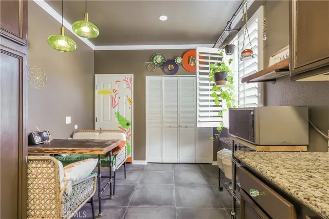 a kitchen that has a lot of cabinets in it
