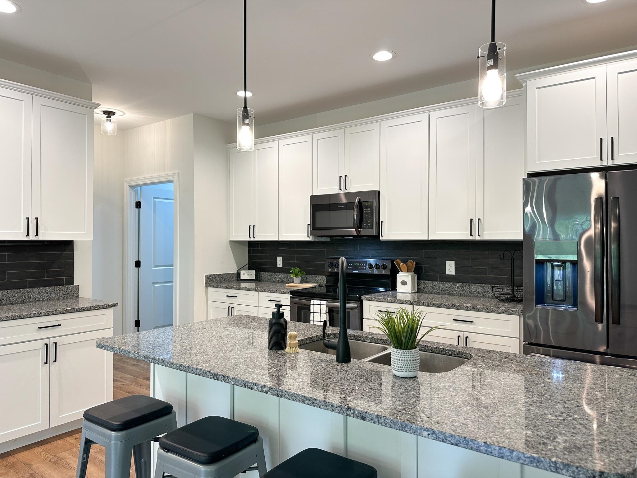 55 Mcilwee Lane Staunton, VA 24401 - Photo 15 of 40 a kitchen with stainless steel appliances granite countertop a sink a stove and a refrigerator